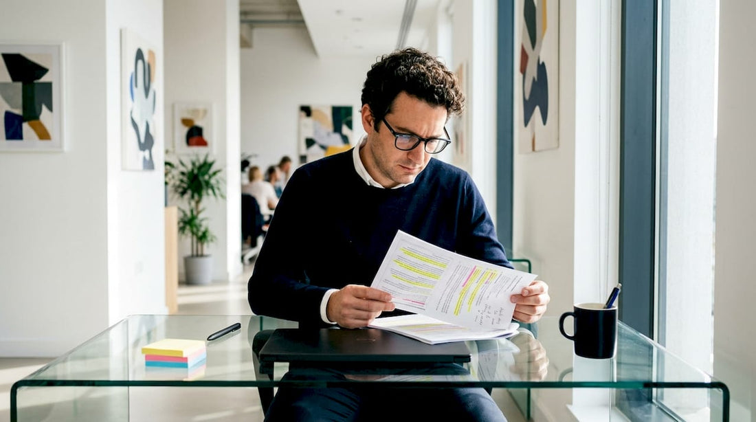 Person reviewing shaping brief document at desk