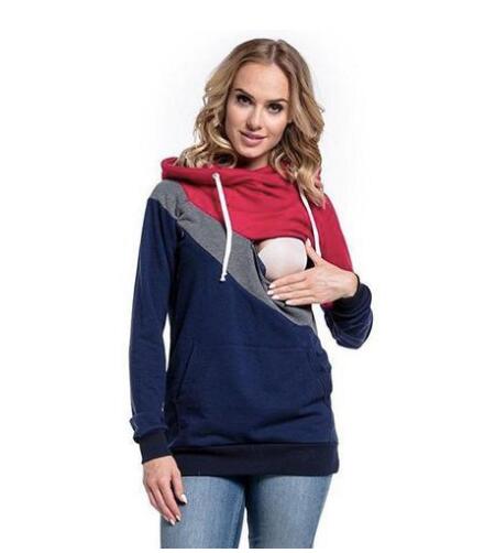 Woman wearing a colorful hoodie with a white background